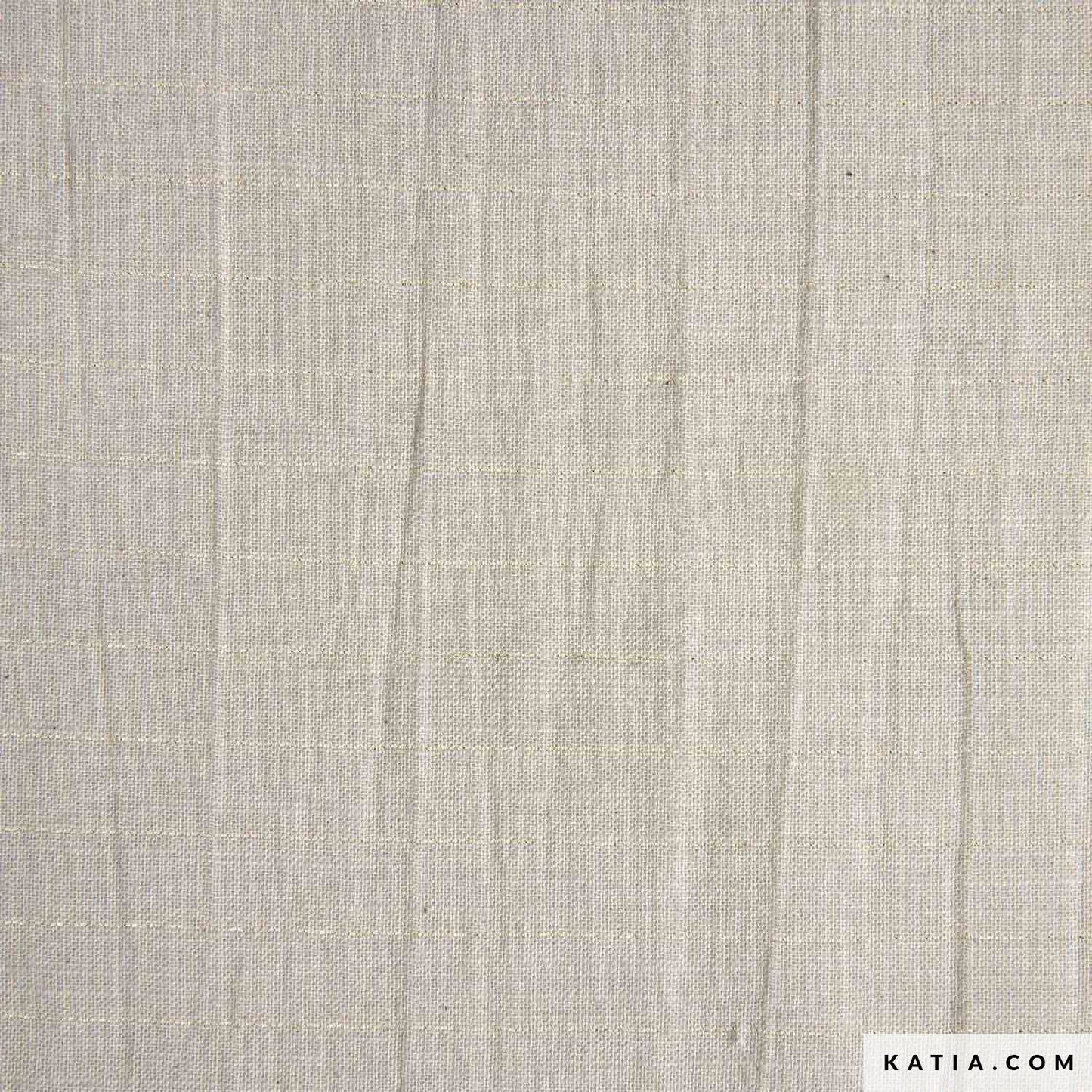 Close up of a beige or linen colour cotton fabric with a light gold contrast thread. 