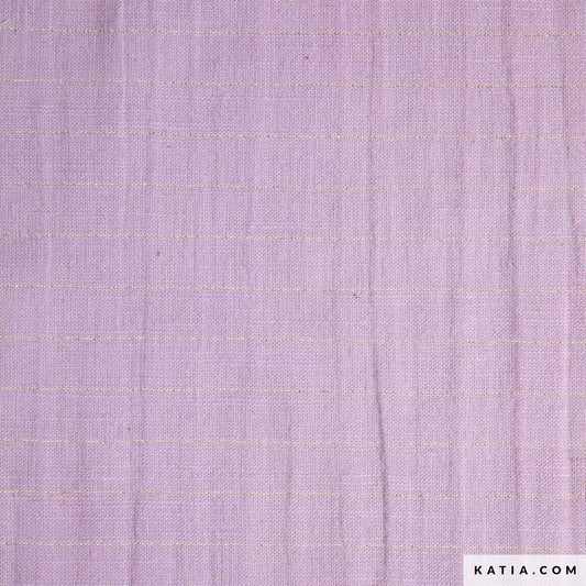 Close up of cotton fabric for sewing garments in lilac with a gold stripe