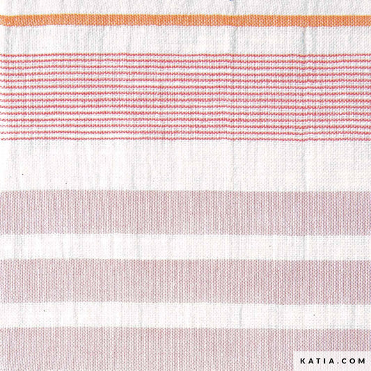 Close up of cotton fabric with pink and orange stripes for sewing and crafting. 