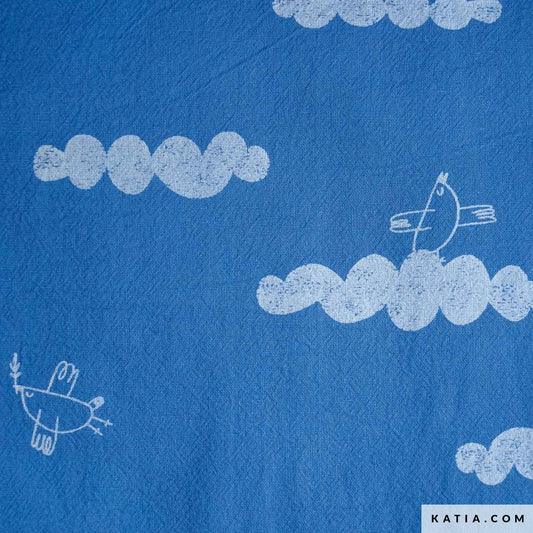 Cotton fabric for sewing children's clothing featuring birds in the clouds on a blue background