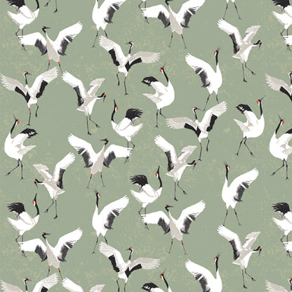 Patterned fabric of white cranes with black legs and necks on a green background from Soar by Katerina Roccella Art Gallery Fabrics premium cotton for sewing and crafting.