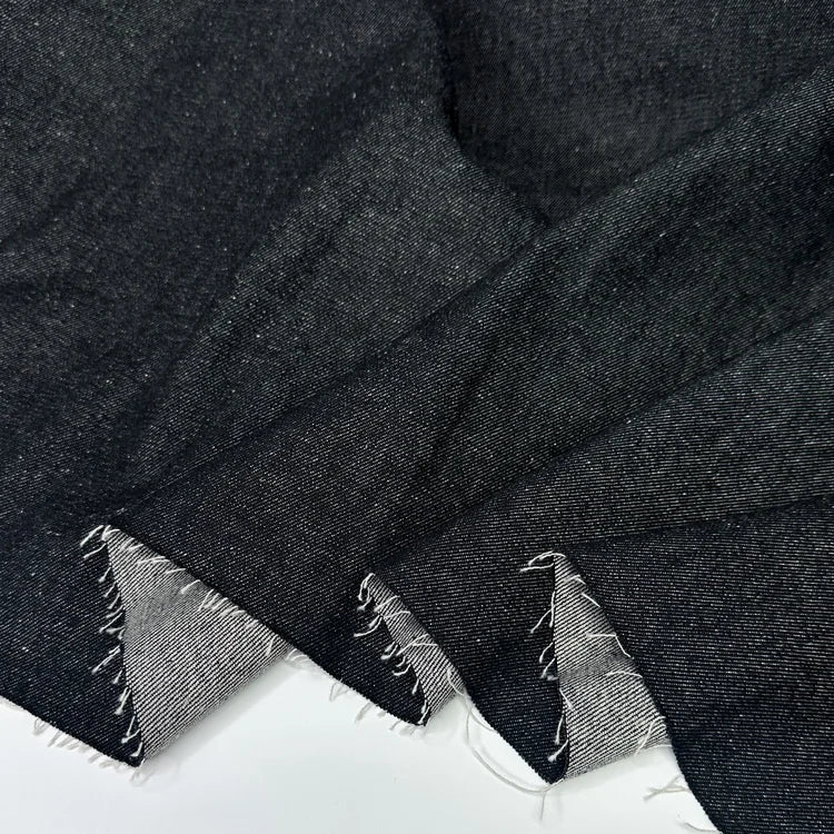 Close-up of a black f100% cotton denim fabric for sewing. 