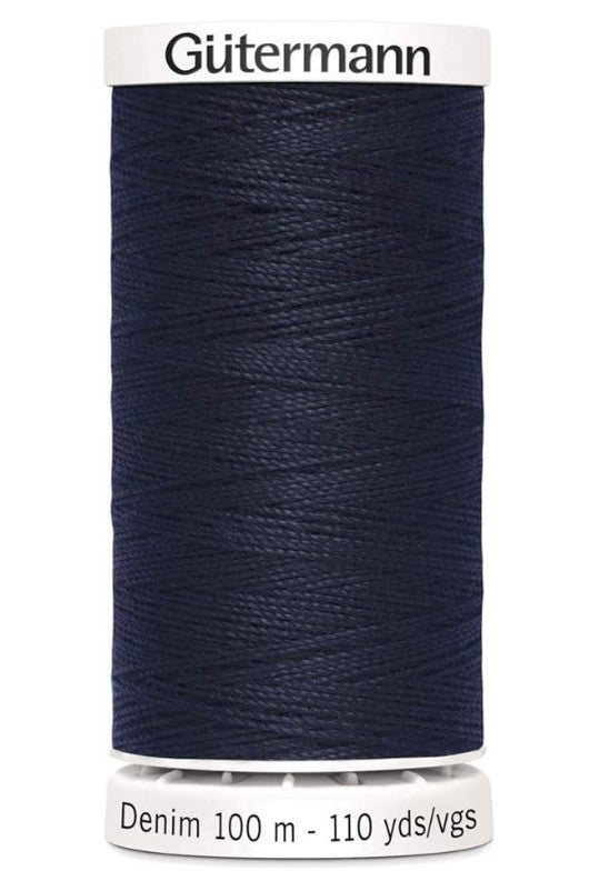 Spool of Gutermann denim thread on a white background