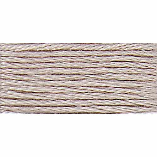 Close-up of beige embroidery floss on a white background