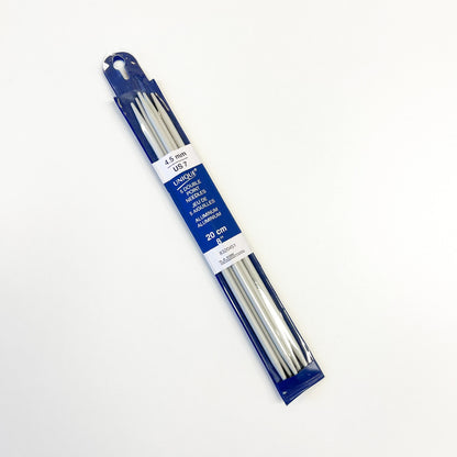 A package of 20 cm aluminum knitting needles in a blue plastic sleeve with a white label, photographed on a plain white background.