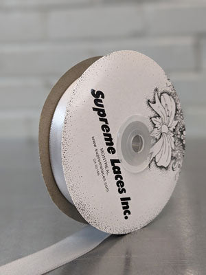 Spool of light gray double face ribbon for crafting and decorating 