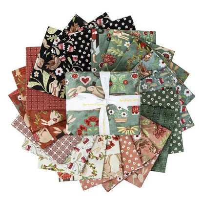 A bundle of various patterned fat quarters of fabric, tied together with a label showing the brand 'Riley Blake' and the name 'Hop Hop Hooray'.
