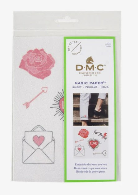 DMC Magic Paper for embroidery packaging with a pink rose and envelope illustration on a white background