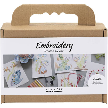 Embroidery kit packaging with illustrations and 'creativ' branding on a white background