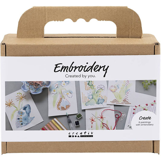 Embroidery kit packaging with illustrations and 'creativ' branding on a white background