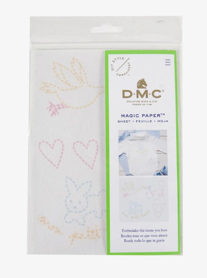 DMC Magic Paper with embroidery designs on a white background