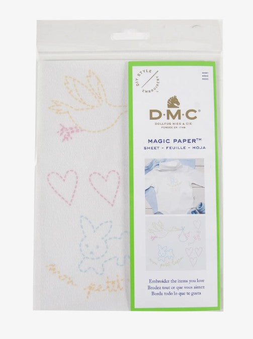 DMC Magic Paper with embroidery designs on a white background