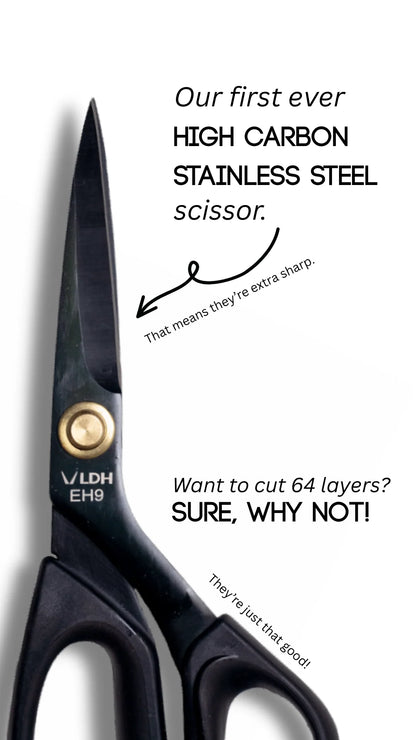 Black scissors with text about high carbon stainless steel quality on a white background
