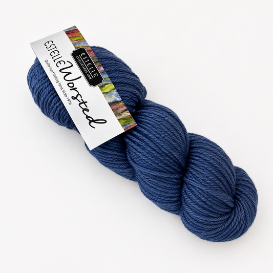 Blue skein of yarn with a label on a white background