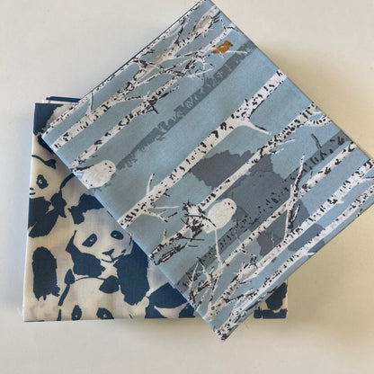 close up of fat quarter bundle pieces in blue theme for sewing and quilting