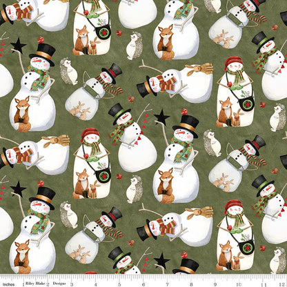 Pattern of snowmen and winter animals on a green background with a ruler for scale.