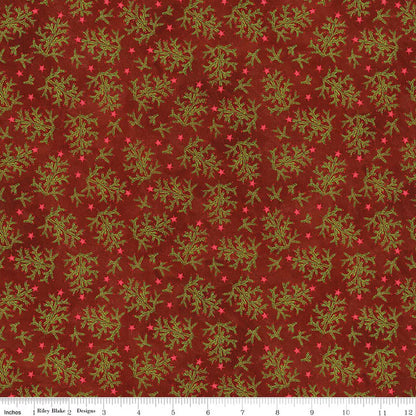 Fabric with green leaf pattern on a red background