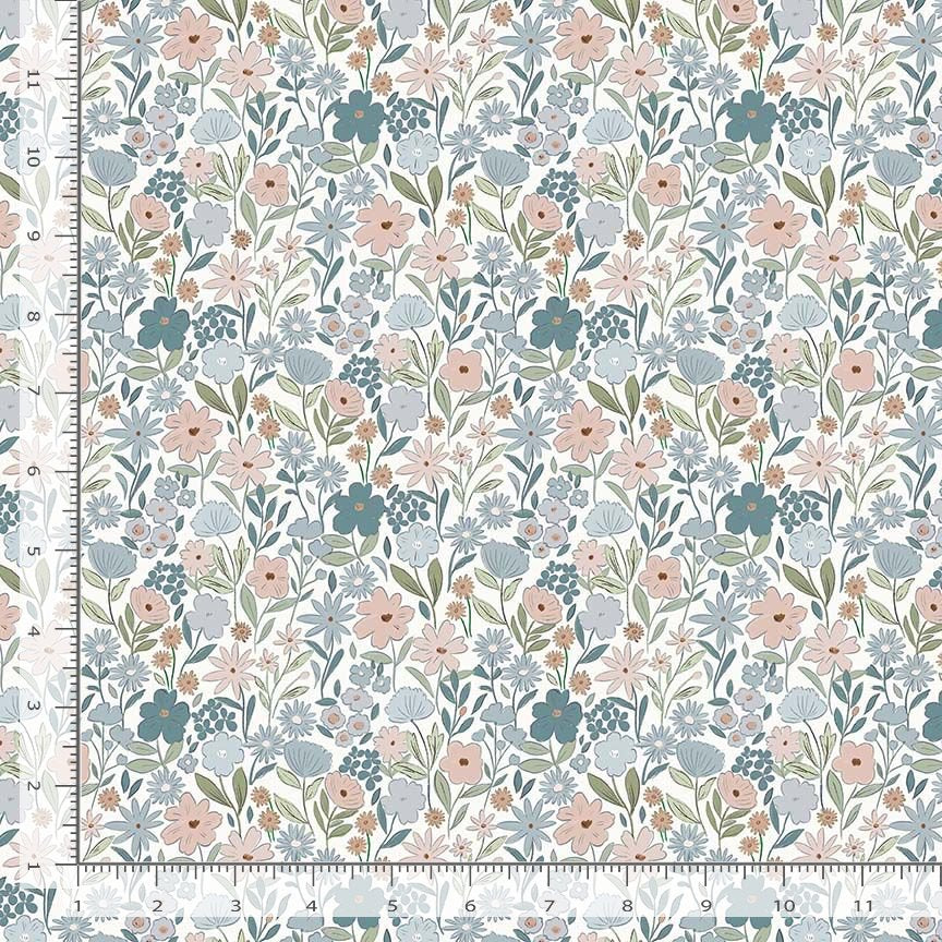 Floral patterned fabric with a ruler for scale on a white background