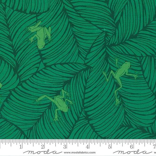 Fabric with green leaf pattern and small green frogs, featuring Moda label.