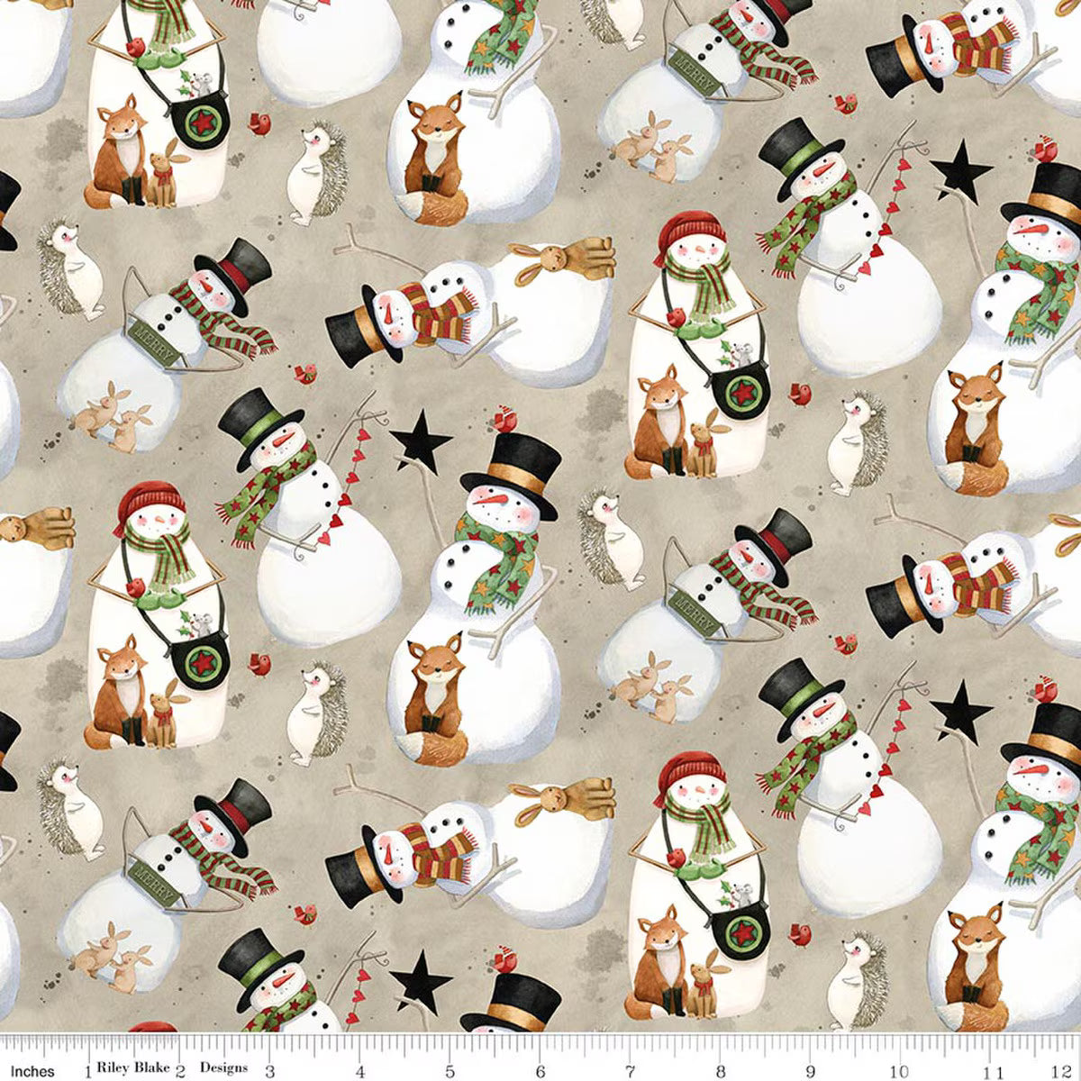 Pattern of snowmen and winter animals on a beige background with a fabric yardstick at the bottom.