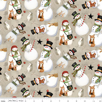 Pattern of snowmen and winter animals on a beige background with a fabric yardstick at the bottom.