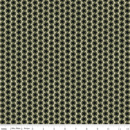 Patterned fabric with geometric design in green and beige