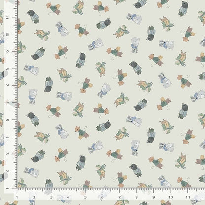 Patterned fabric with small figures and a ruler on the side for sewing and quilting