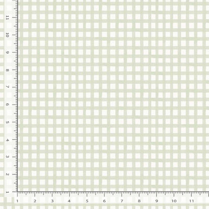 Grid pattern fabric swatch with a ruler on the side for quilting and sewing crafting