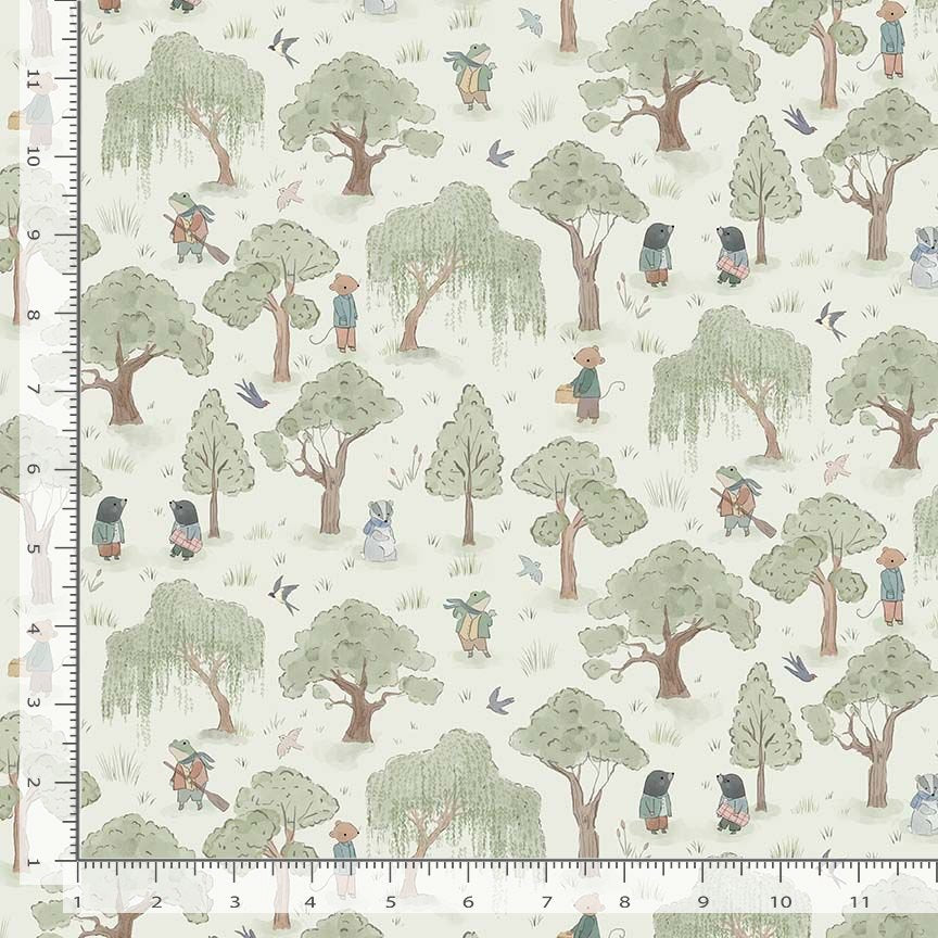 Fabric with a pattern of trees and people in a forest, with a ruler for scale.