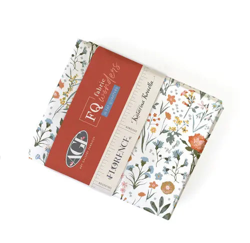 A bundle of 16 fat quarters featuring a floral pattern with various colors on a white background, packaged in a red and white box with the brand name 'Art Gallery' by Katrina Roccella visible.