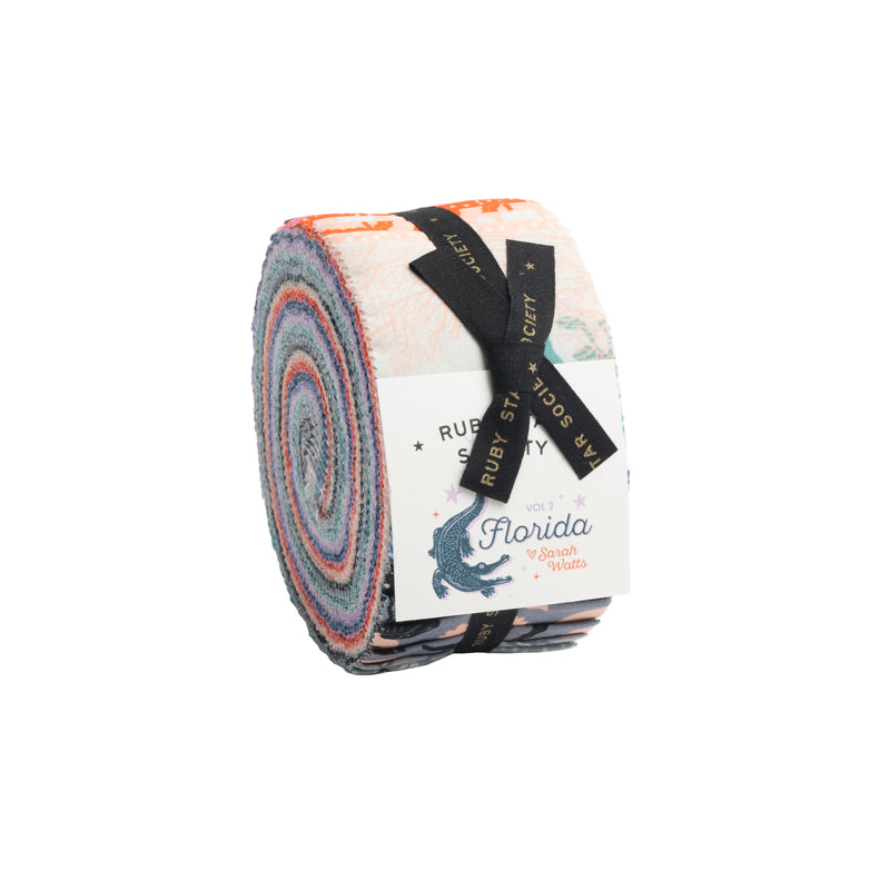 A rolled fabric bundle with a black ribbon label reading 'RUBY STAR SOCIETY' and a white paper tag that says 'Florida Vol. 2