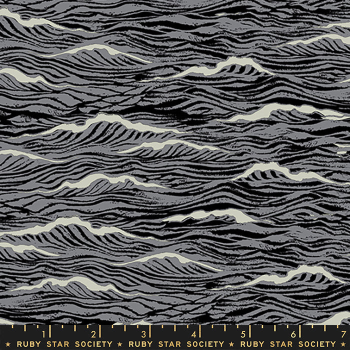 A close-up of a fabric pattern featuring wavy, zebra-like black and gray stripes with off-white highlights, with a Ruby Star Society ruler visible at the bottom edge.