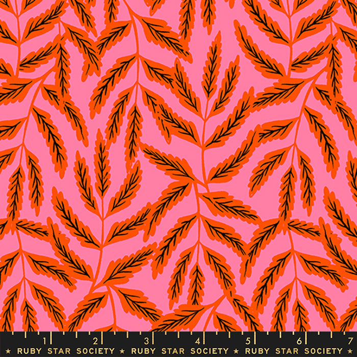 Fabric with a repeating botanical pattern of orange leafy stems on a bright pink background, with a black measurement ruler along the bottom edge labeled Ruby Star Society.