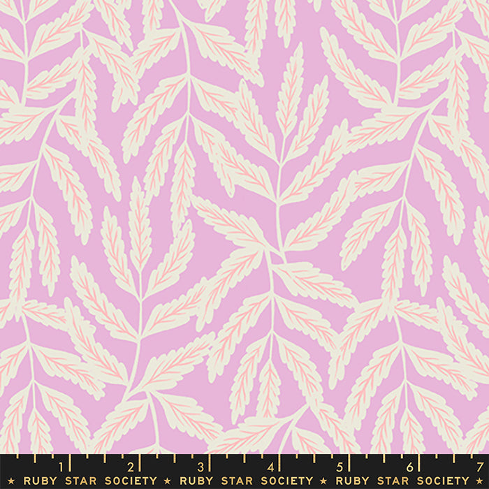 Fabric with a repeating botanical pattern of cream leafy branches on a light pink background, with a black ruler along the bottom edge labeled Ruby Star Society.