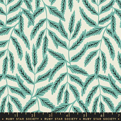 Fabric with a repeating botanical pattern of teal and dark green leafy stems on a warm cream background, with a black ruler strip along the bottom edge labeled Ruby Star Society.