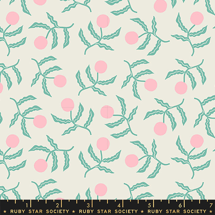 A repeating fabric pattern featuring light pink cherries and mint green leaves on a warm cream background, with a black ruler at the bottom displaying 'RUBY STAR SOCIETY' and inch markings.