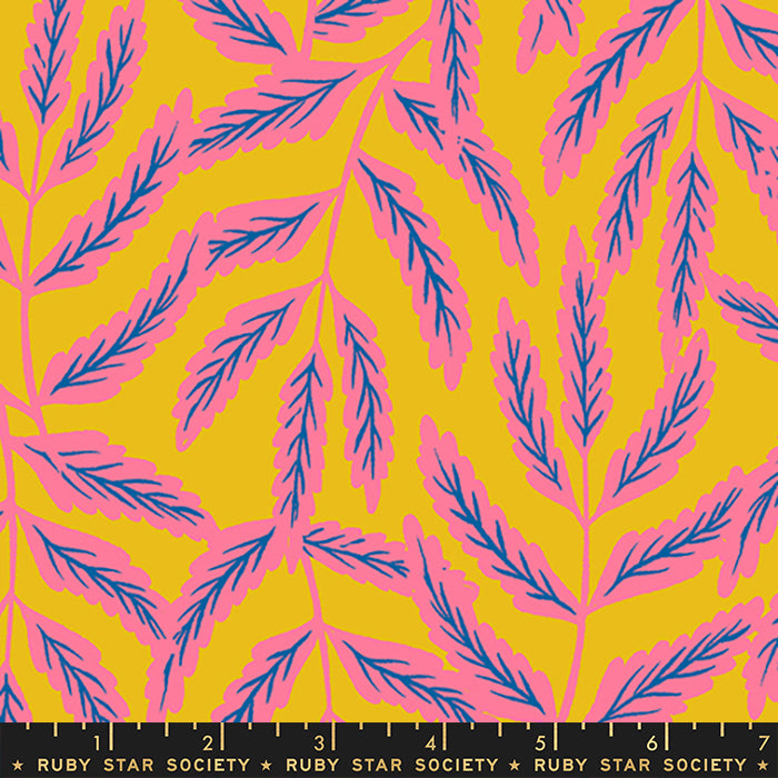 A repeating botanical pattern with pink leafy branches on a bright yellow background, shown flat with a black ruler along the bottom edge labeled Ruby Star Society.