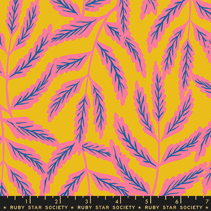 A repeating botanical pattern with pink leafy branches on a bright yellow background, shown flat with a black ruler along the bottom edge labeled Ruby Star Society.