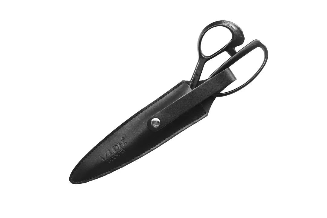 Black leather scissor or shear sheath on a white background