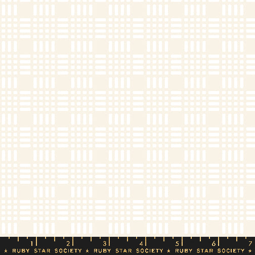 A repeating fabric pattern of white geometric plaid and stripe motifs on a warm cream background, with a black ruler along the bottom edge displaying the Ruby Star Society brand.