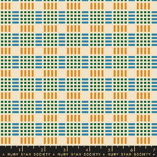 A repeating geometric pattern of blue, green, and orange blocks on a warm cream background, with a black ruler strip at the bottom labeled Ruby Star Society.