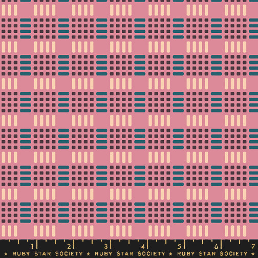 Fabric with a repeating geometric pattern featuring pink, dark purple, teal blue, and cream blocks and dashes, with a black ruler strip at the bottom labeled Ruby Star Society.
