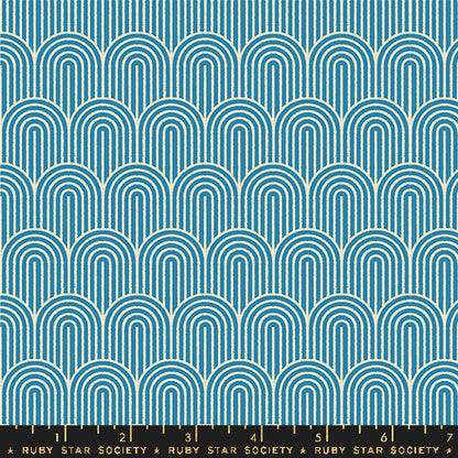 A repeating geometric pattern of teal and cream arches, shown as a fabric or wallpaper swatch with a Ruby Star Society ruler along the bottom edge.