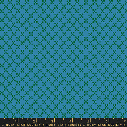 A close-up of a repeating fabric pattern in teal and dark green, with a dark ruler strip along the bottom edge labeled Ruby Star Society.