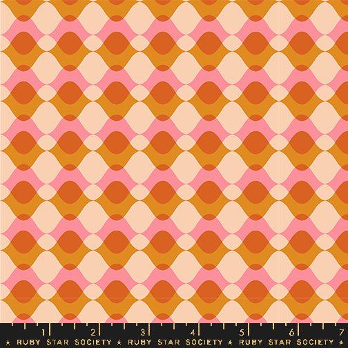 Fabric with a repeating mid-century modern geometric pattern featuring wavy horizontal bands in orange, peach, pink, and cream, with a black ruler at the bottom showing the Ruby Star Society brand and measurements.