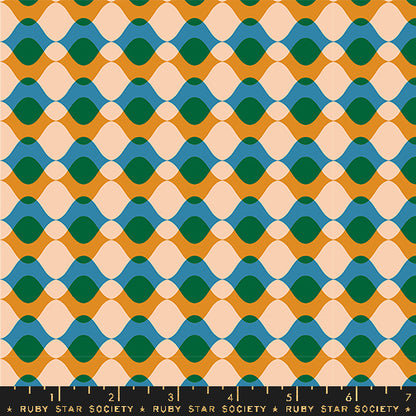 Fabric with a repeating geometric pattern of wavy horizontal bands in mustard yellow, teal blue, dark green, and pale peach, with a black ruler along the bottom edge marked Ruby Star Society.