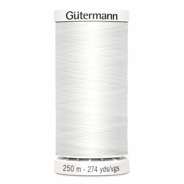 Spool of Gutermann thread on a white background