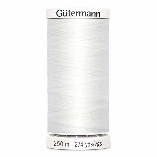 Spool of Gutermann thread on a white background