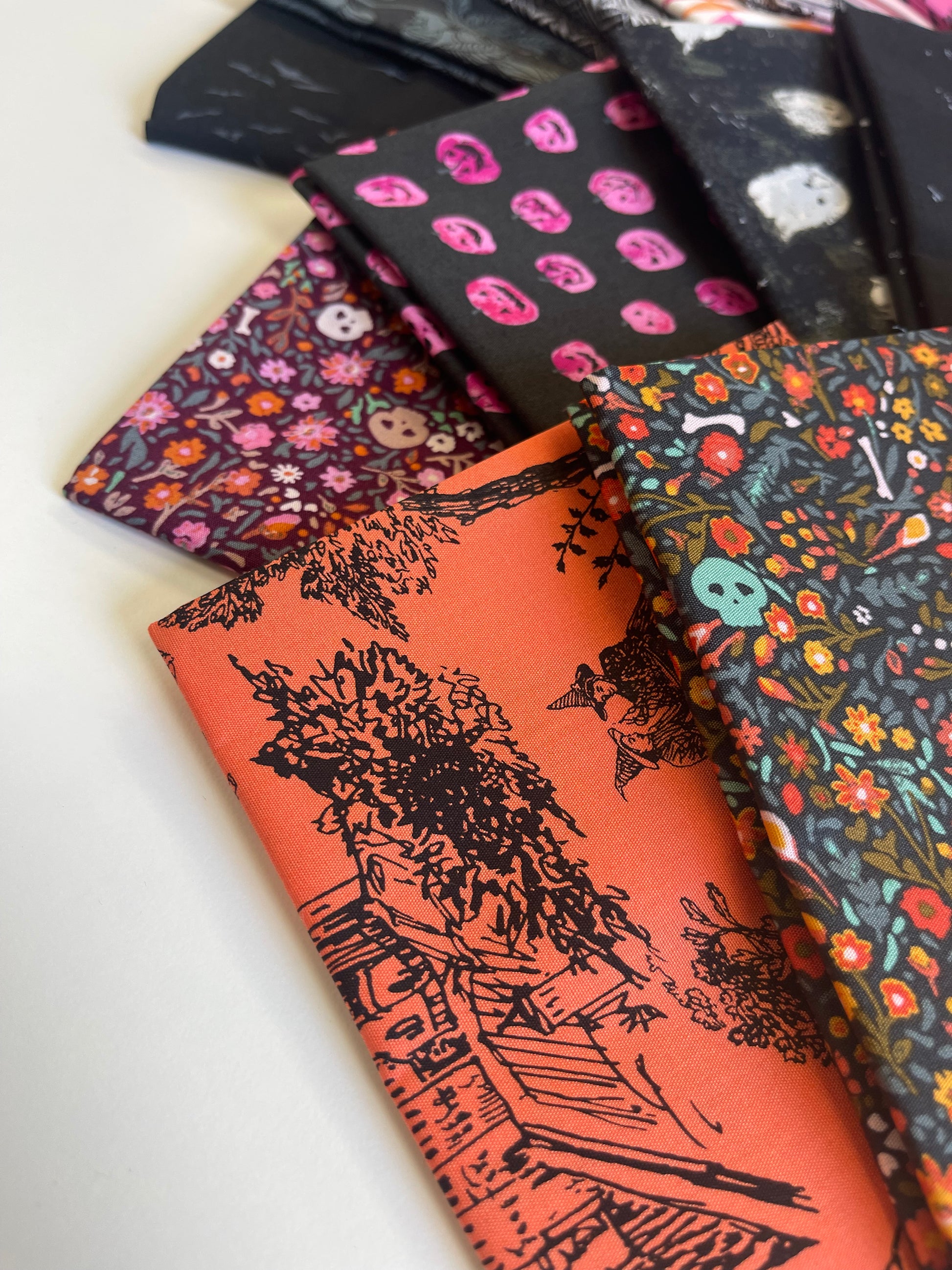 Collection of patterned fabric swatches on a white background