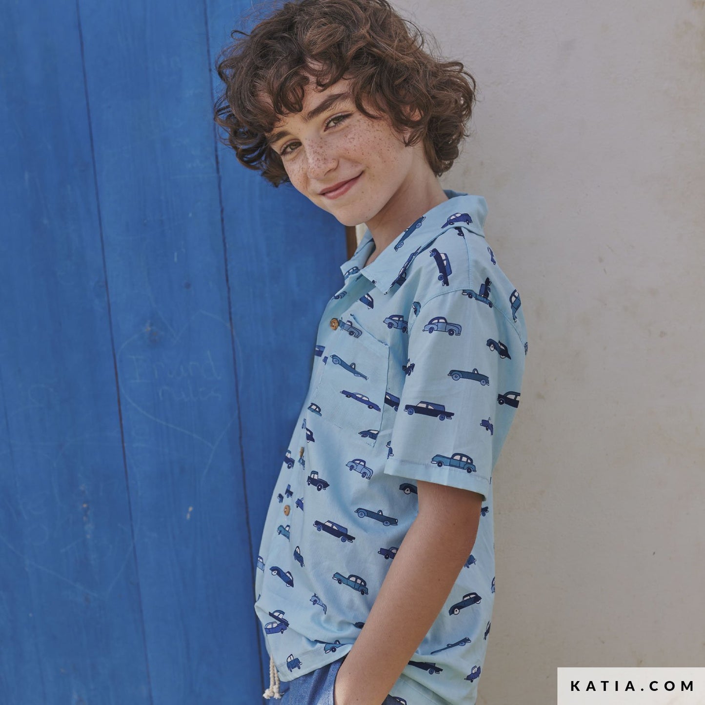 boy wearing a shirt made with katia blue poplin with cars
